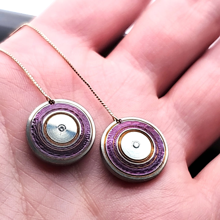 Chroma - Lathed, multi-colour titanium drop earrings on long 14k yellow gold threaders with a drop length of 5 centimetres. Each disc is 15 mm in diameter, light and delicately floating.