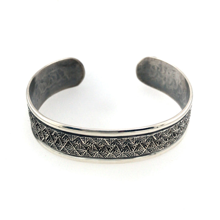 Stamped sterling silver cuff bracelet with border. Size large.