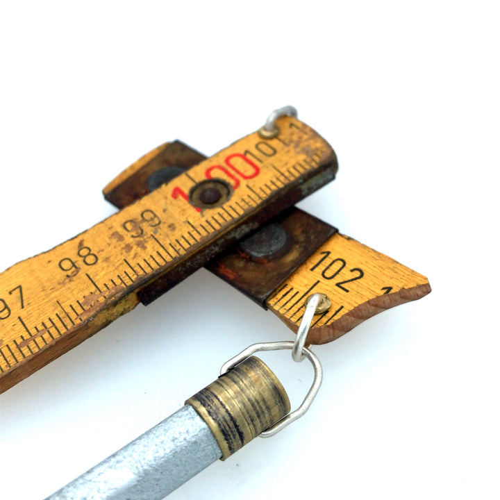 Made to Measure pendant. This wearable assemblage combines vintage boxwood ruler, vintage pencils, brass fittings, and sterling silver findings. 5.3 x 3 cm.