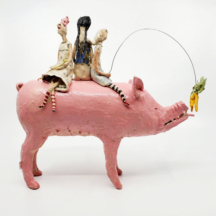 Buyers Market, 2023. Witches ride to the market on the back of a pig, which follows a tempting carrot. 