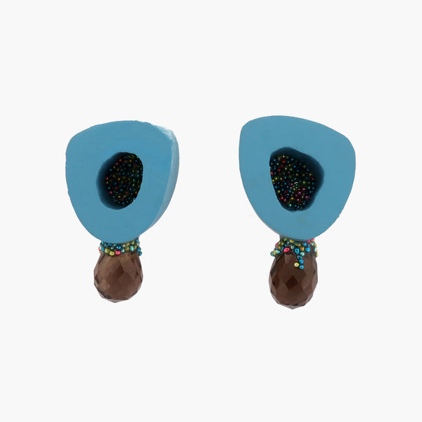 Playful and bright stud earrings, created from painted ovine (lamb) bone in blue and smoky quartz. The earrings are backed with sterling silver and have sterling silver posts.   1.5 x 2.7 x 0.8 cm, 2023