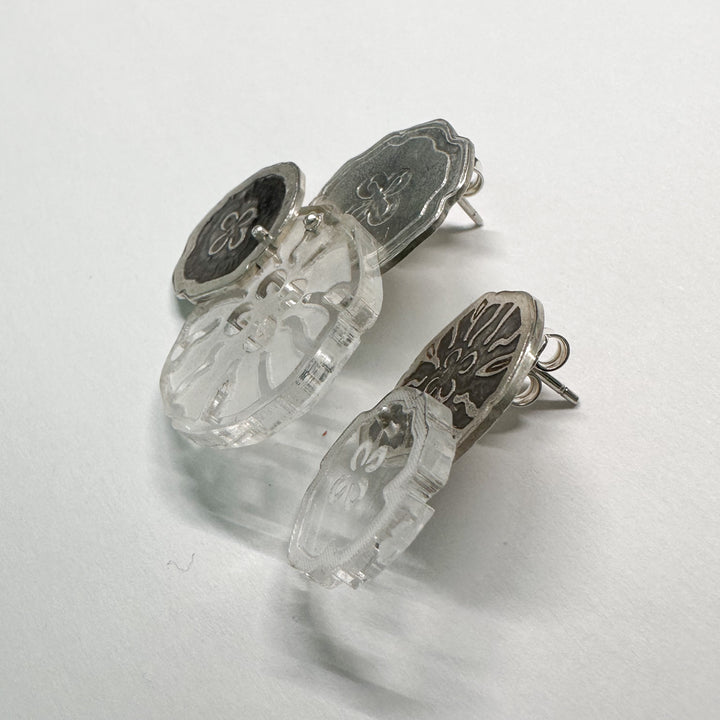 Jellyfish Earrings, 2023.  Large and light asymmetrical stud earrings in sterling silver and acrylic.