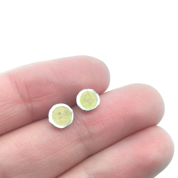 Yellow resin studs in sterling silver and enamel.