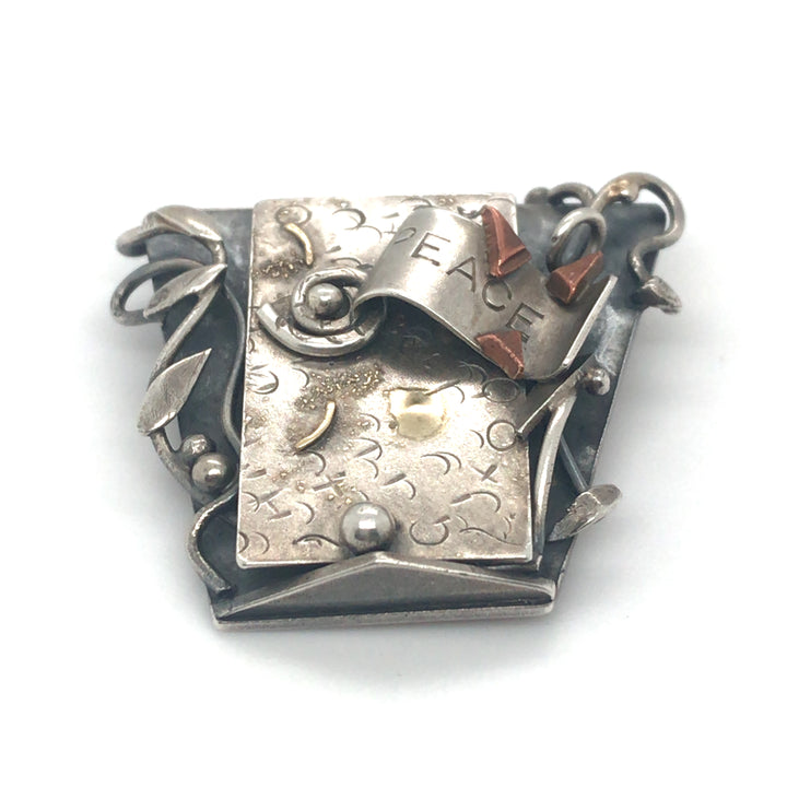 One of a kind brooch of sterling silver elements with fine gold and copper details. 