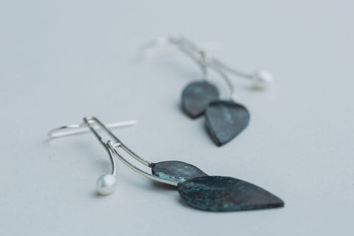 “Leaf Line” Earrings - Patinated copper earrings with a freshwater pearl and sterling silver.