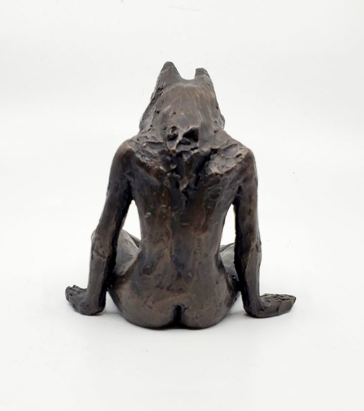 Anna Williams She Wolves series. She Wolf sitting cross-legged. Individual cast bronze sculpture. Approx. 7" x 4" x 3".