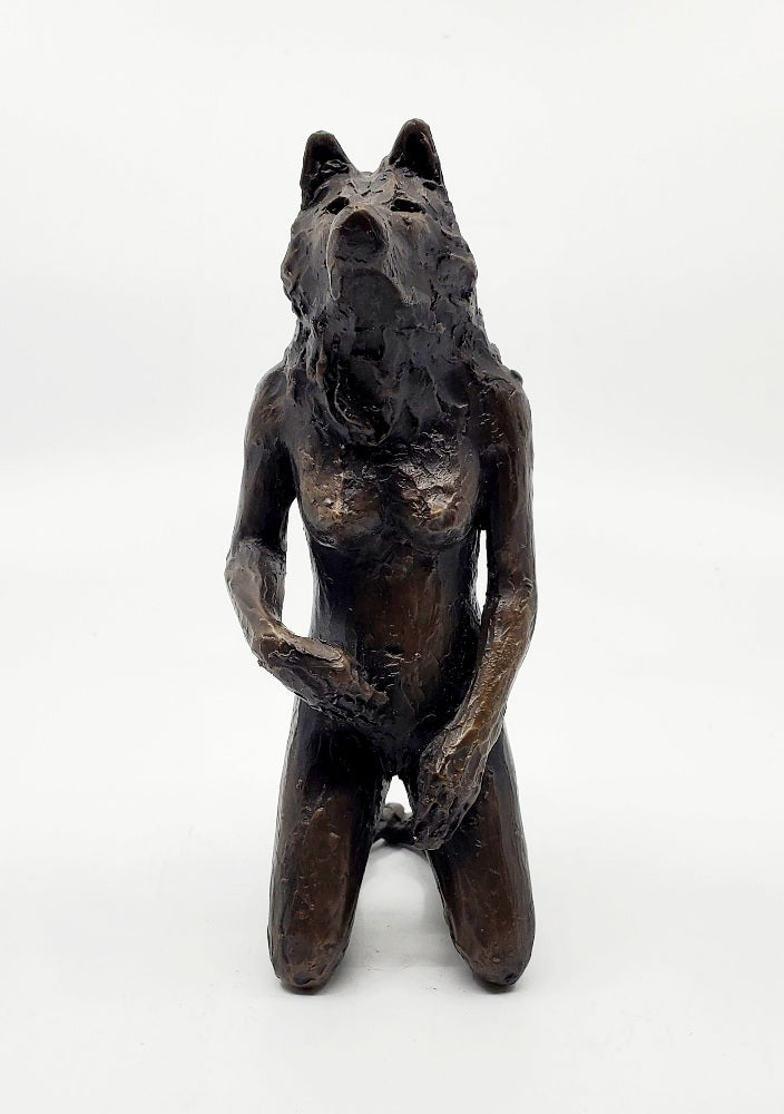 Anna Williams She Wolves series. She Wolf kneeling with one hand touching her belly. Individual cast bronze sculpture. Approx. 7" x 4" x 3".
