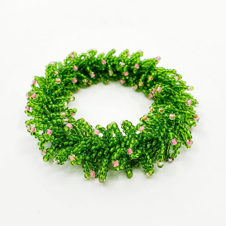 Yael Krakowski Green Caterpillar Bracelet with glass beads and thread.