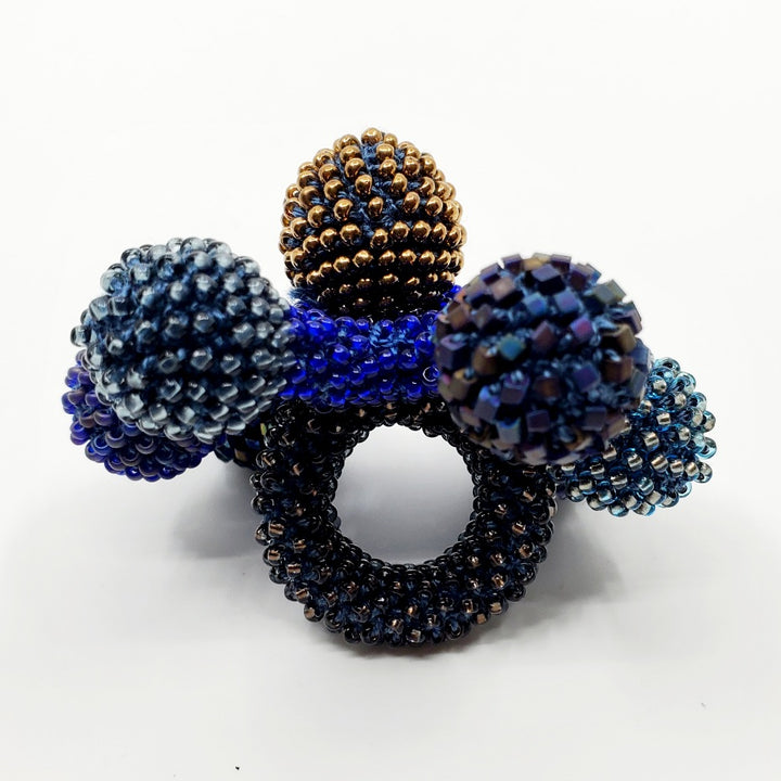 Yael Krakowski Blue Flower Ring with glass beads, and thread.