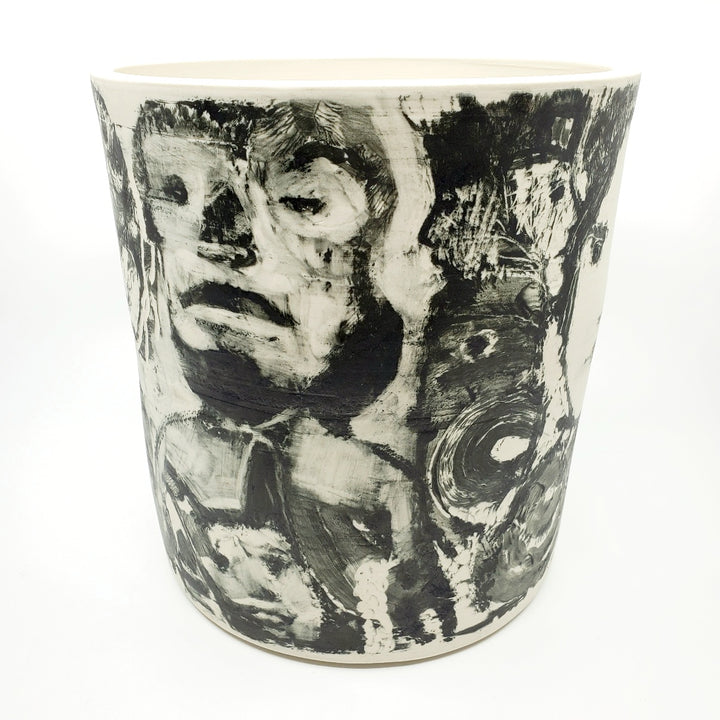 Large ceramic vessel - 1. Hand painted porcelain vessel. Black glaze has been applied in careful layers to depict faces and patterns. 23 x 23 x 25 cm.