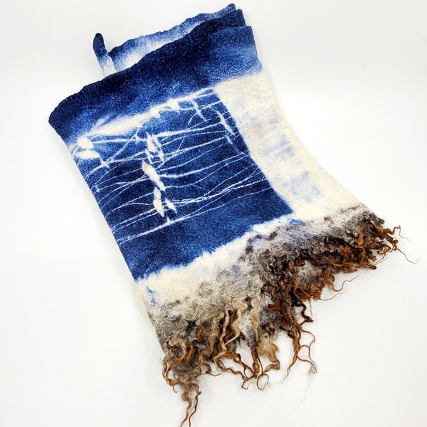 Blue and ivory scarf, created with hand-dyed silk and merino wool with recycled materials. 