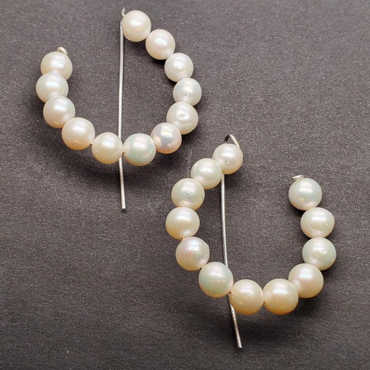 Pearl hoops, each with twelve 6mm pearls. 