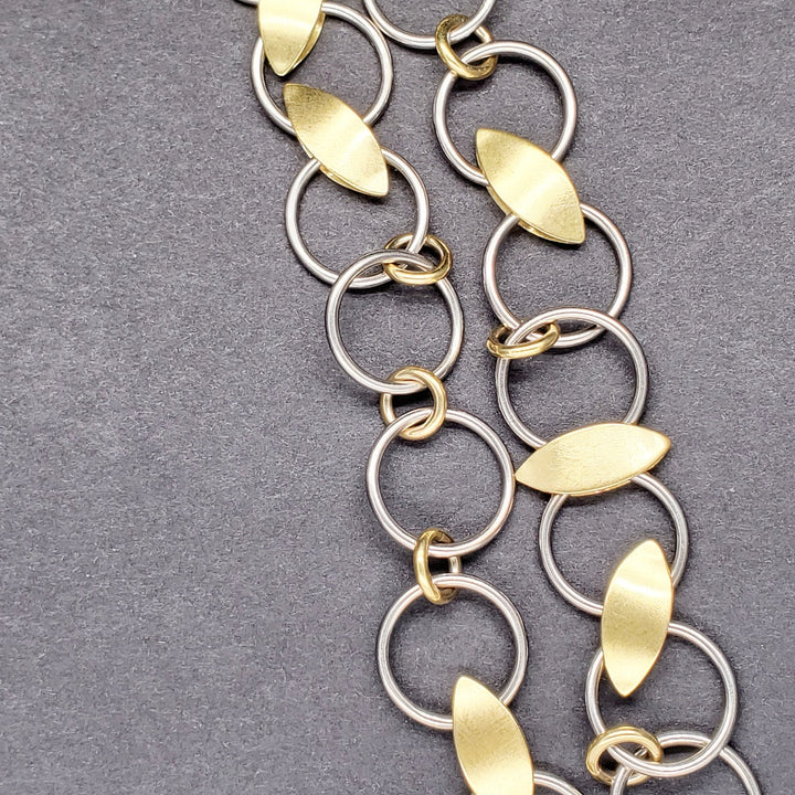 Chain link necklace made from 18K yellow gold and palladium white gold.