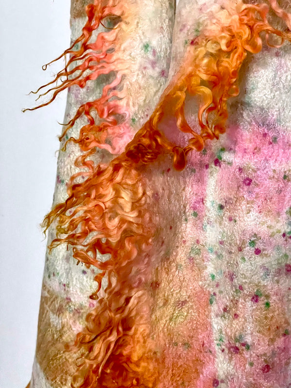 Long orange scarf in hand-dyed silk and merino wool, with recycled materials.