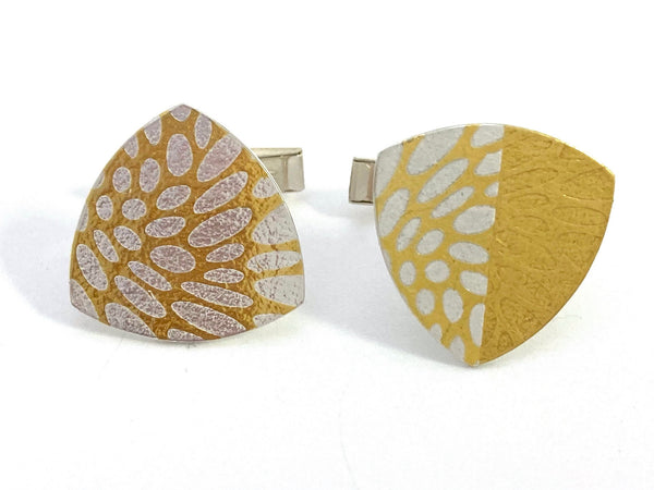 These Trillion keum-boo cufflinks are sterling silver with 24 karat gold that has been diffusion-bonded and formed, resulting in an exciting interplay between two fine metals. Measuring approximately 3cm x 3cm.