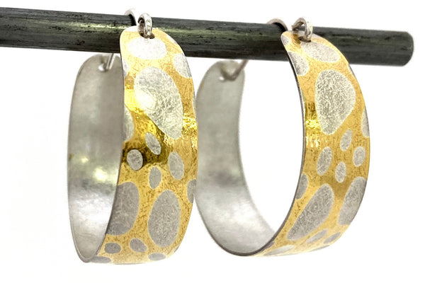 These Creoles earrings are comprised of silver and 24 karat gold which has been diffusion bonded and formed