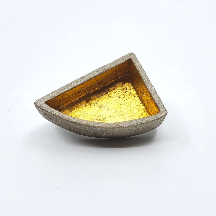 Arc box pin of concrete with  a 24K gold interior. 
