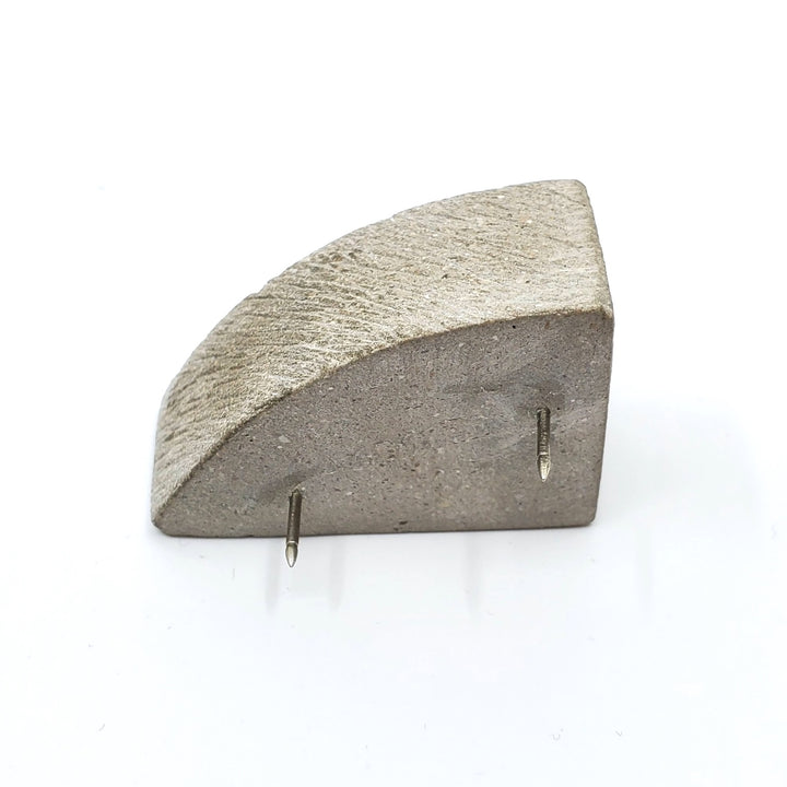 Arc box pin of concrete with  a 24K gold interior. 