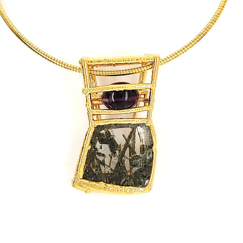 Pendant of electroformed 24kt gold-plated welded stainless steel and copper wire, tourmilated quartz, and amethyst, on a 20" 24k gold-plated coil. 