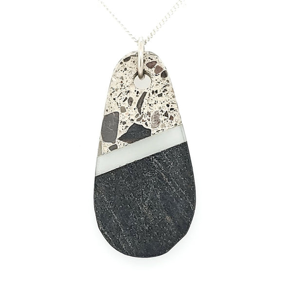 Rock and glass pendant on an 18” sterling silver chain.