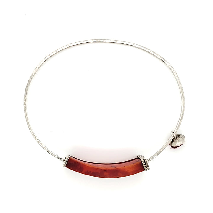 Bangle of sterling silver with camel bone and felt, which has a slight and pleasant jingling sound when worn.