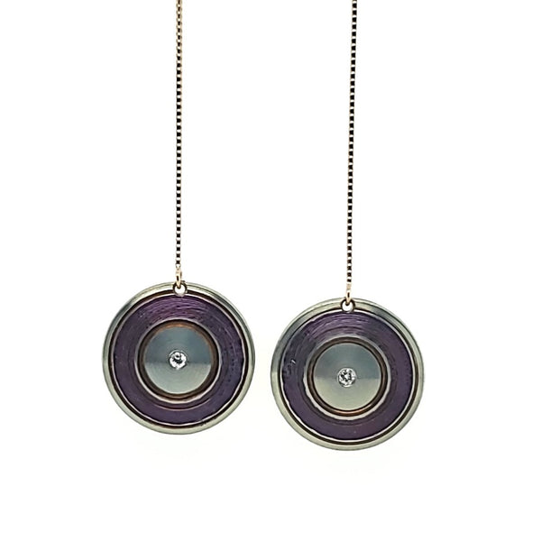 Chroma - Lathed, multi-colour titanium drop earrings on long 14k yellow gold threaders with a drop length of 5 centimetres. Each disc is 15 mm in diameter, light and delicately floating.