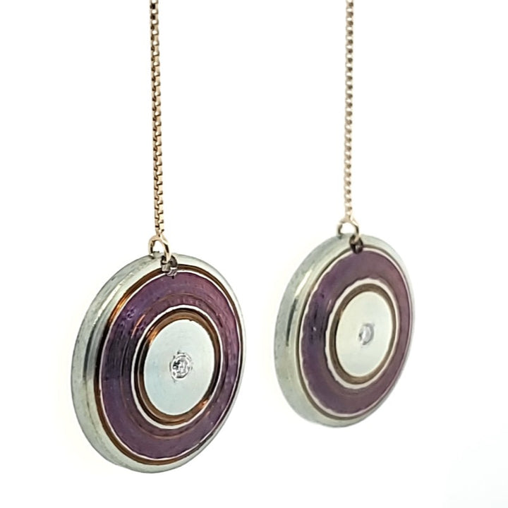 Chroma - Lathed, multi-colour titanium drop earrings on long 14k yellow gold threaders with a drop length of 5 centimetres. Each disc is 15 mm in diameter, light and delicately floating.