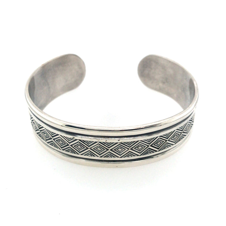 Stamped sterling silver cuff bracelet with border. Size large.