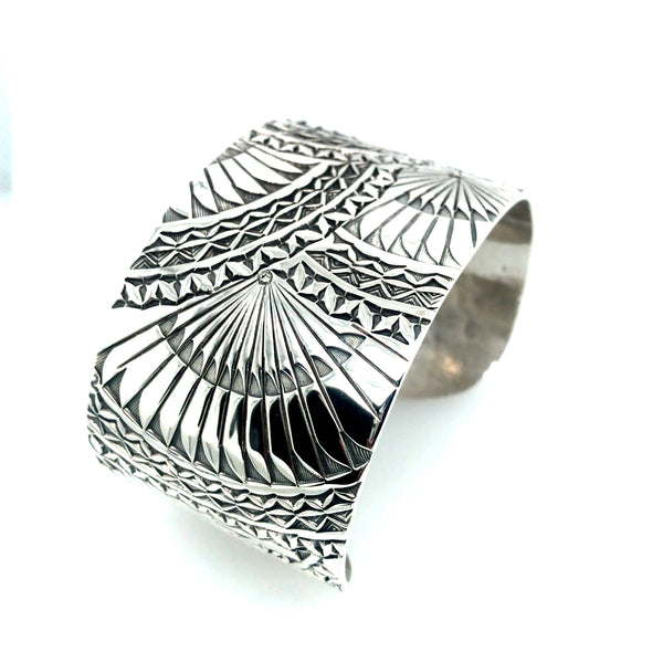 Wide sterling silver cuff bracelet with hand stamped Japanese fan pattern. Size large.