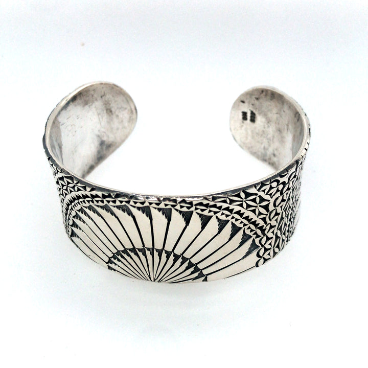 Sterling silver cuff bracelet with hand stamped Japanese fan pattern. Size medium.