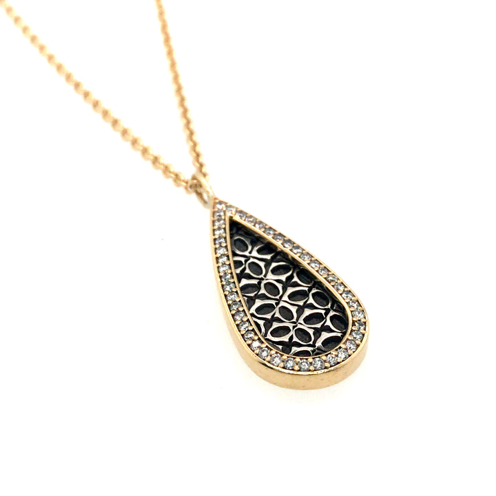 Tear drop pendant in sterling silver and 18k gold with diamonds, on an 45cm (18") 18k yellow gold chain.