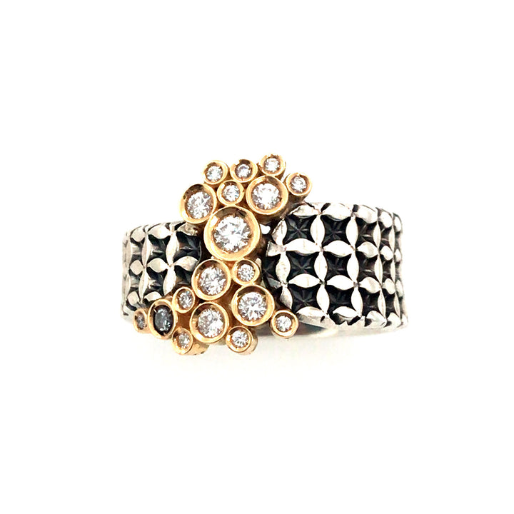 Hand stamped sterling silver ring with a bubble of diamonds set in 18k gold. 
