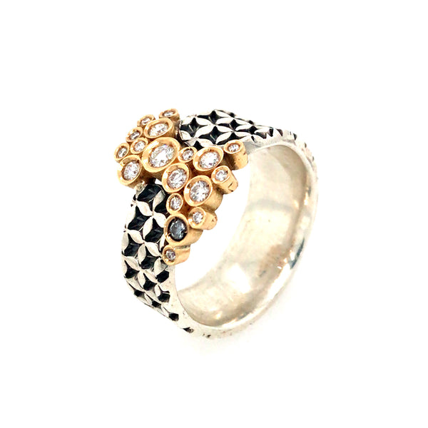 Hand stamped sterling silver ring with a bubble of diamonds set in 18k gold. 