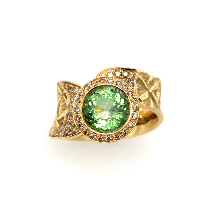 Hand stamped 18k gold ring with peridot and champagne diamonds. Size 6.25.