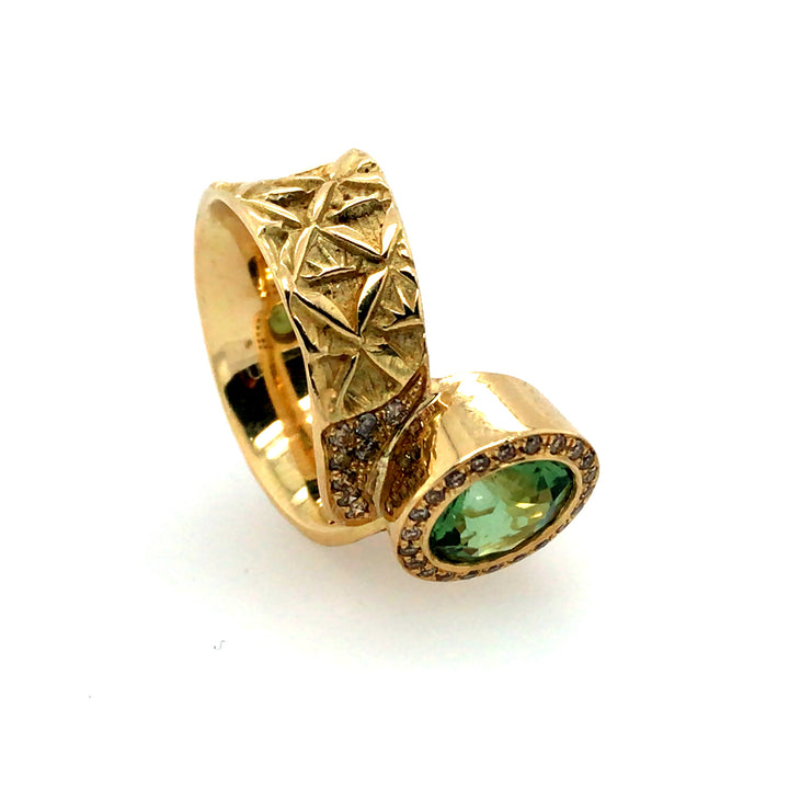 Hand stamped 18k gold ring with peridot and champagne diamonds. Size 6.25.