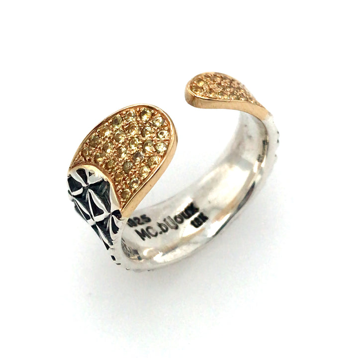 Hand stamped ring in sterling silver and 18k gold with yellow sapphires. Size 7.