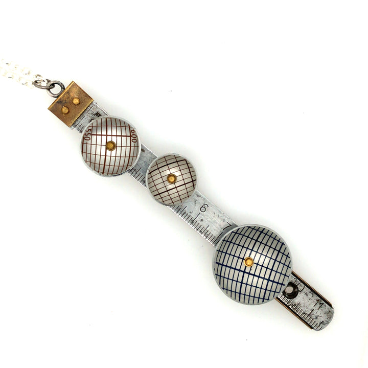 Made to Measure pendant. This wearable mixed media assemblage combines vintage aluminum rulers, copper and brass rivets, and brass micro bolts. Each piece is unique. 11.5 x 2.6 cm, on a 26" sterling silver chain.