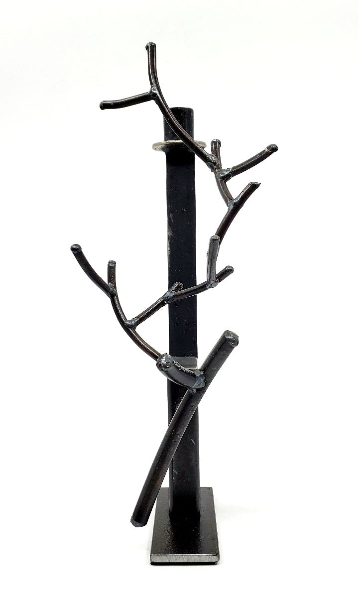 Chandelier, candle holder of found metals from which grows a branch or an antler of welded iron. 7" x 6" x 13.5"