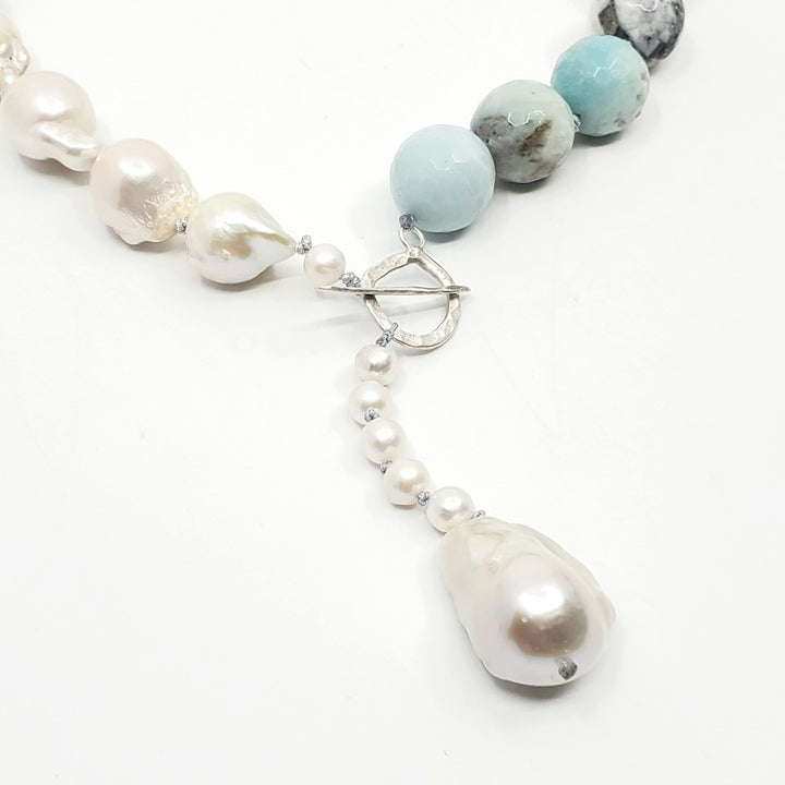 Necklace of amazonite and baroque pearls, hand-knotted between each bead, with a handmade silver clasp. The amazonite beads are 1.5 cm in diameter.