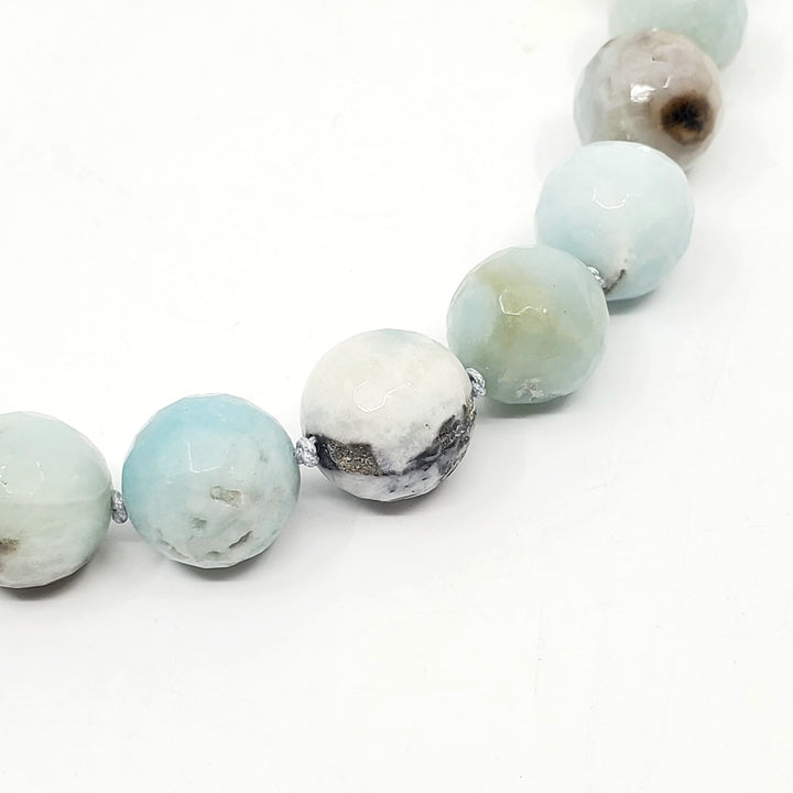 Necklace of amazonite and baroque pearls, hand-knotted between each bead, with a handmade silver clasp. The amazonite beads are 1.5 cm in diameter.