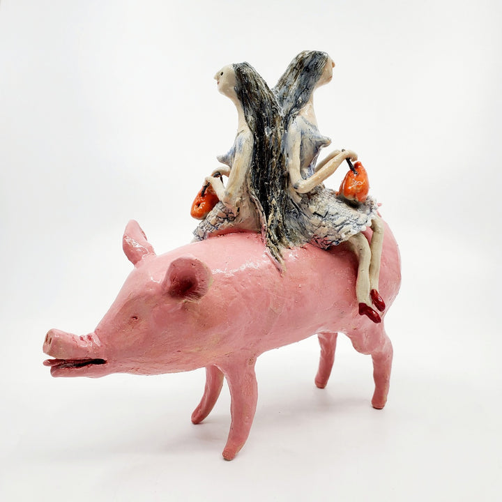 To Market, To Market: Ceramic figure of a pig with twin witches on its back, each holding orange purses.