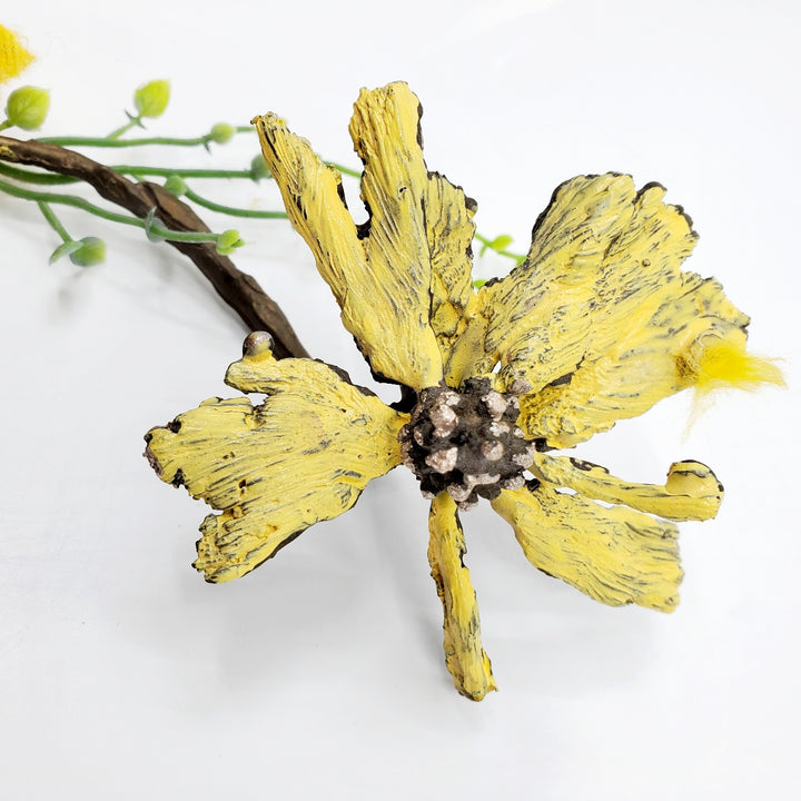 Wall Flower: Bronze and mixed medium flower sculpture, which hangs suspended from the wall or arches up from a flat surface.