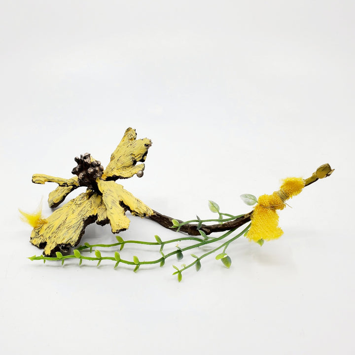 Wall Flower: Bronze and mixed medium flower sculpture, which hangs suspended from the wall or arches up from a flat surface.