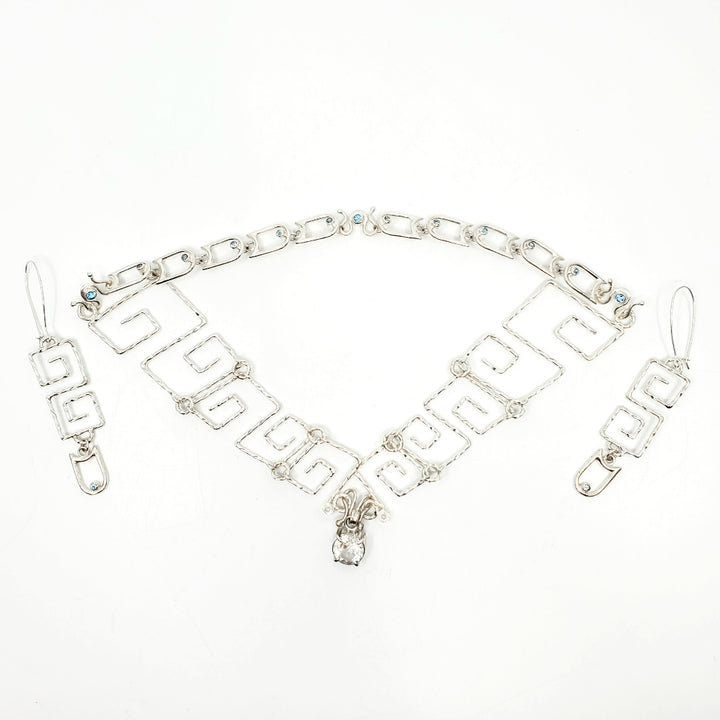 White Tiger (白虎), 2023.  This hand fabricated set--which include a neckpiece and earrings--is made from sterling silver, white and blue topaz. Every part is detachable and can be worn separately.