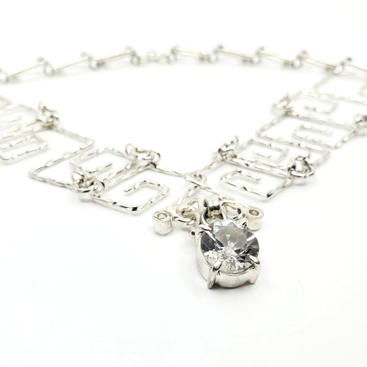 White Tiger (白虎), 2023.  This hand fabricated set--which include a neckpiece and earrings--is made from sterling silver, white and blue topaz. Every part is detachable and can be worn separately.