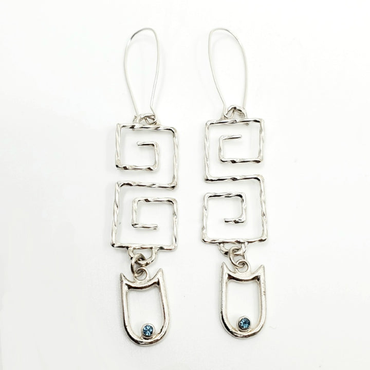 White Tiger (白虎), 2023.  This hand fabricated set--which include a neckpiece and earrings--is made from sterling silver, white and blue topaz. Every part is detachable and can be worn separately.