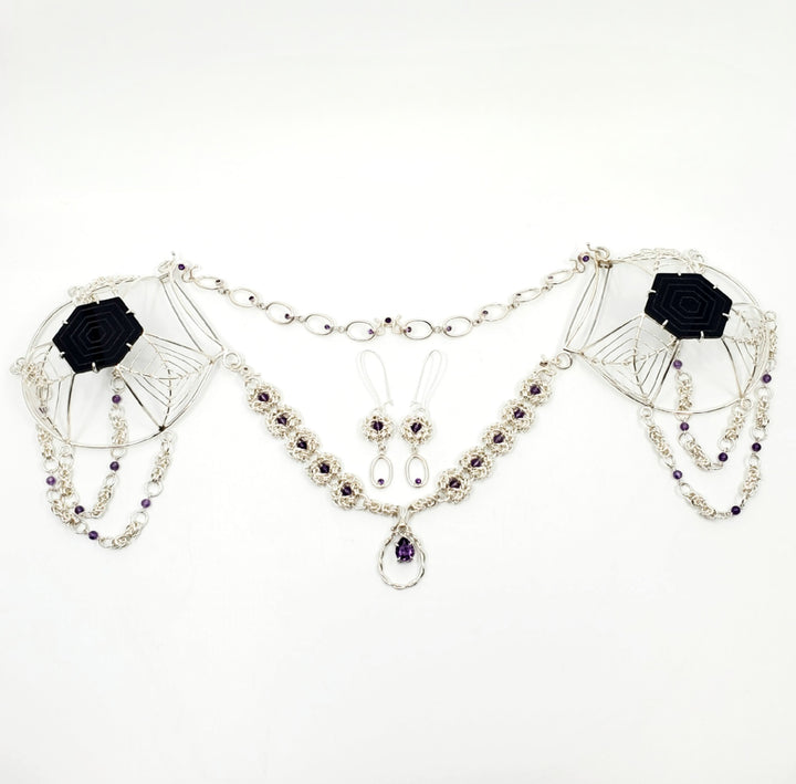Murky Warrior (玄武), 2023.  This hand fabricated set with pauldrons--which can be separated into a neckpiece,  brooches, and earrings--is made from sterling silver, amethyst, amethyst beads, and acrylic. Every part is detachable and can be worn separately.