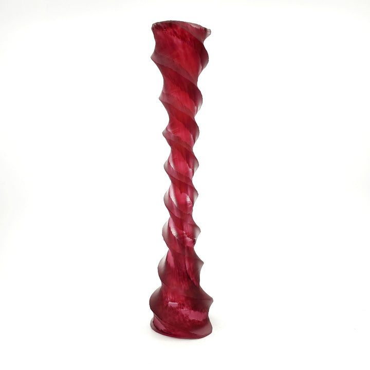 Blown and carved medium candlestick. Blown and carved medium candlestick in pink-red.