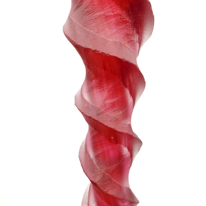 Blown and carved medium candlestick. Blown and carved medium candlestick in pink-red.