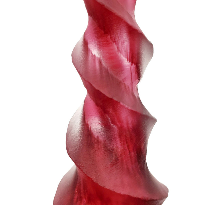 Blown and carved medium candlestick. Blown and carved medium candlestick in pink-red.